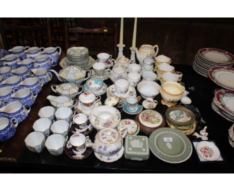 A quantity of floral decorated tea ware, Wedgwood jasperware, Royal Worcester, candlesticks, and a framed plaque depicting a 