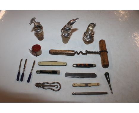 A box containing corkscrew, bottle stoppers, pen knives etc.