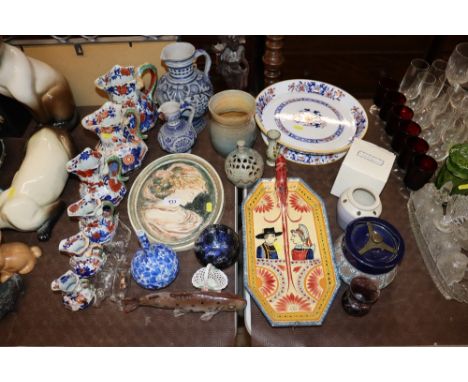 A graduated set of Masons' ironstone patent jugs (some AF) German blue and white jugs, wall plaque, Henriot Quimper dish, a t