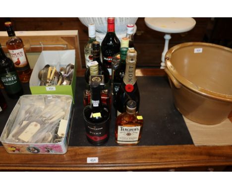 A collection of various alcohol to include Moet Champagne, Teachers Scotch Whisky, Disaronno, Bacardi, and Gordons London Dry