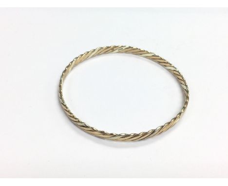 A 9ct gold rope twist bangle, approx 14g. (U10). Shipping category A.