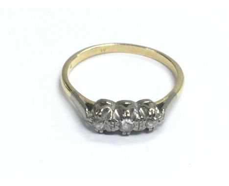 An 18ct gold three stone diamond ring, approx 3.6g and approx size R. Shipping category A.