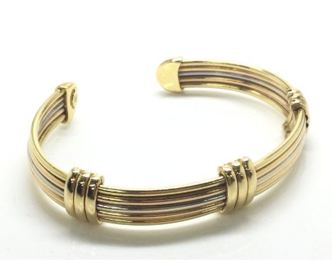 A heavy 18ct 3 colour gold bangle, approximately 24.8g. (A)