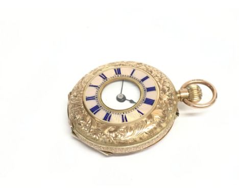 A 9ct gold button wind pocket watch with enamel face. 33mm case 26.9g. Winds and runs. Postage A