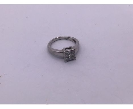 A white metal 9 stone princess cut cluster ring (size K) approximately 5.9g (A)