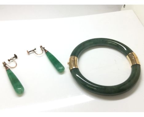 A pair of vintage Jade earrings with yellow metal mounts together with a Jade bangle mounted with 14ct gold hinges and clasp 
