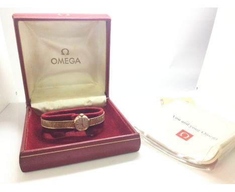 Vintage Cased 9ct Omega ladies watch with paperwork, 17.3g. (B)