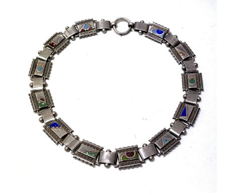 A Victorian white metal (tested silver) collar necklace each panel with gold overlay and enamel decoration. (A).
