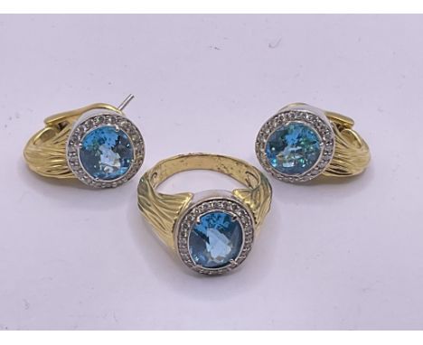 18ct gold diamond and blue topaz ring and earring set. 1earring broke. Postage category A. Approx 27g. Ring size R.