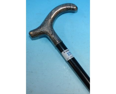 An Art Nouveau ebonised walking stick with white metal handle, stamped '800'