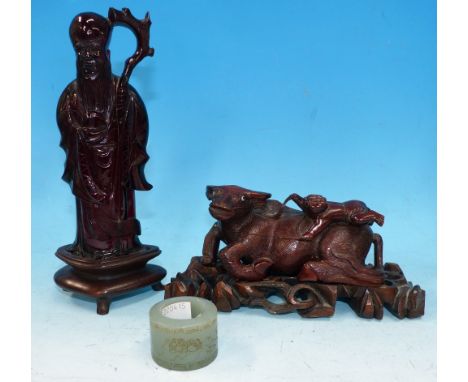 A Chinese carved hardstone archer's item; 2 carved figures