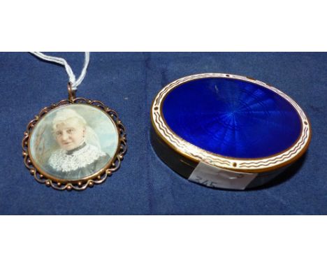 A Victorian pendant with miniature portrait of an old lady, in beaded yellow metal frame; an oval patch box with blue enamel 