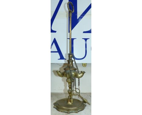 A Middle Eastern 4 light brass oil lamp
