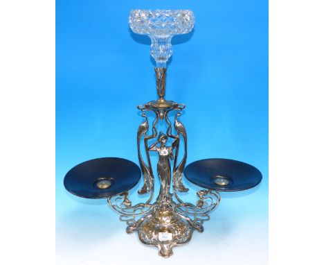 An Art Nouveau silvered table centre with female figure and twin peacocks to the column, 2 side dishes and central glass flut