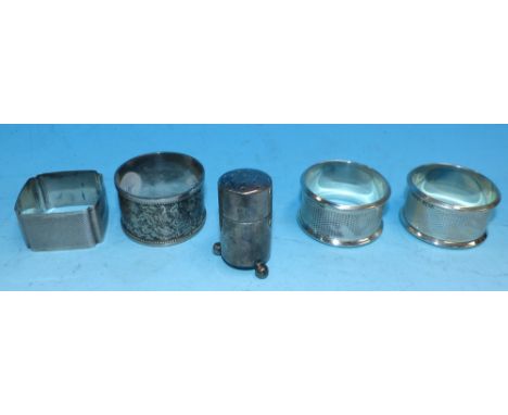 A pair of engine turned napkin ring, Birmingham 1984; 2 other silver napkin rings and a silver salt, various dates