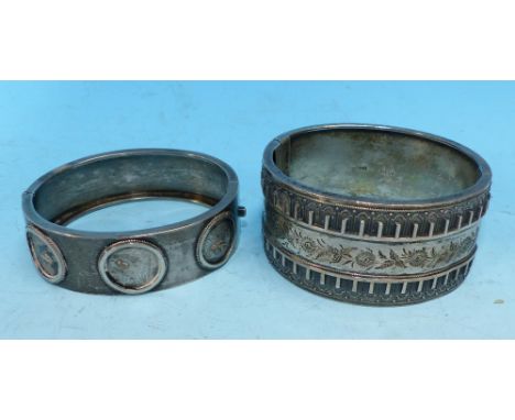 A late Victorian stiff hinged silver bangle; and another