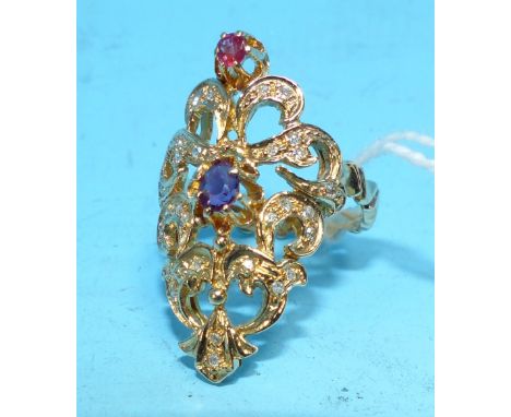 An ornate yellow metal "Byzantine" style ring set multiple small diamonds and 2 coloured stones, unmarked