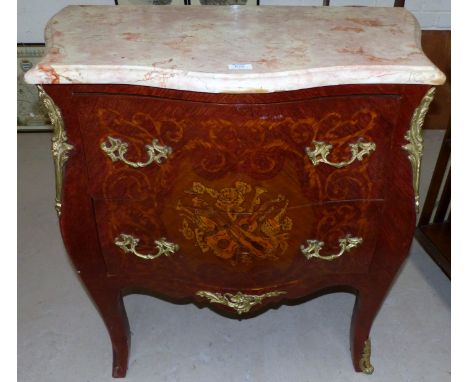 A Louis XV style serpentine front bombe commode chest with parquetry and inlay effect