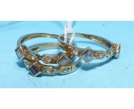 A trio ring set ruby and white sapphires, unmarked