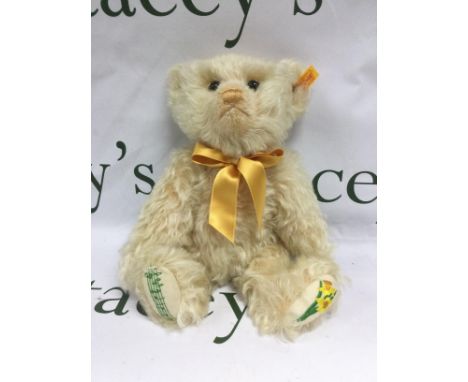 A boxed Steiff bear, daffodil and music and notation detail on feet, approx 30cm. Shipping category B.