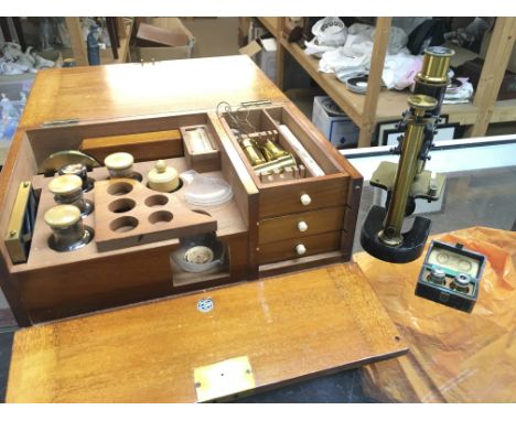 An Austrian microscope by C. Reichert Wien with a wooden case of lenses and other accessories. This lot cannot be posted
