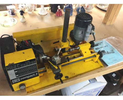 An Emco Compact 5 lathe with manual. This lot cannot be posted