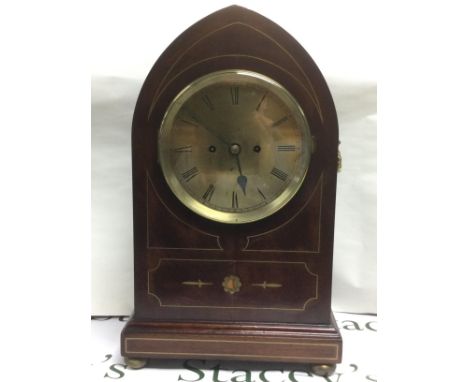 An eight day inlaid mahogany arch top mantle clock, approx height 51cm. Shipping category D.