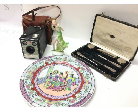 A Kodak brownie flash II, 20th century Japanese plate, ceramic figure of a lady and a cased silver hallmarked set of nail fil