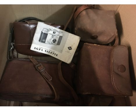 A box containing cameras various including Kodak