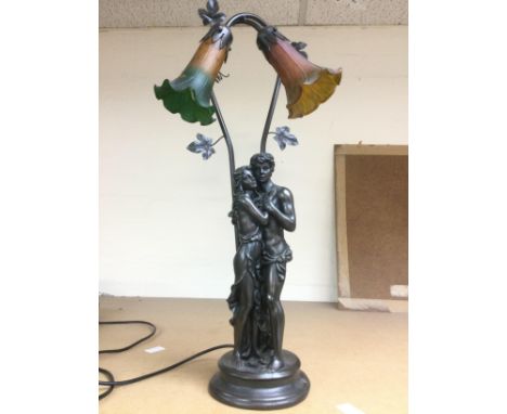 A figural table lamp with coloured glass shades, approx height 68cm. Shipping category D.