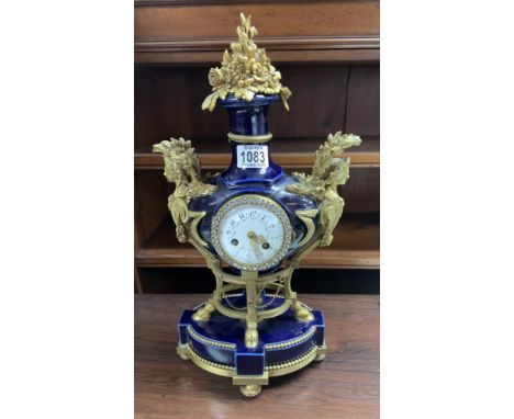A 19th century French Louis XVI style Sevres porcelain and ormolu mantel clock. Heavily restored example.