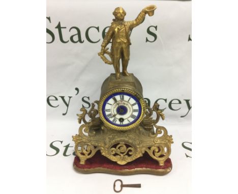 A French gilt ormolu mantle clock with painted enamel dial and with a finely dressed gentleman to the top, approx height 36cm