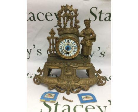 A French gilt mantle clock with painted enamel dial and further painted enamel panels, in need of attention. Approx height 34