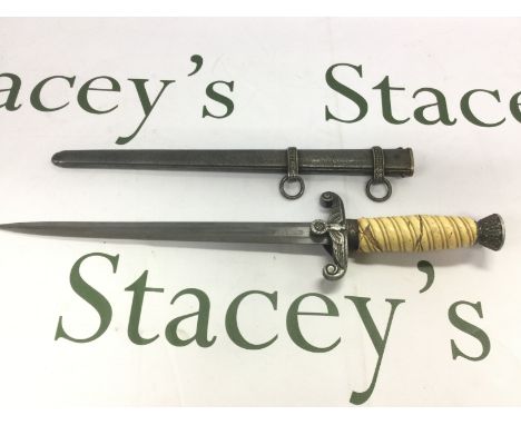 A Third Reich dagger and scabbard. Some damage to handle. Shipping category D.