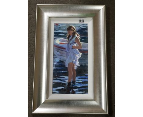 A Limited edition silver Framed print depicting a young girl paddling. By Sheree Valentine Daines