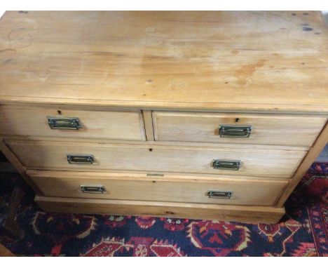 A light wood chest of drawers. 106 x 44 x 77cm.