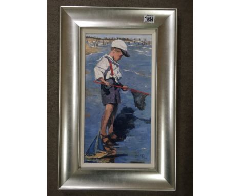 A silver framed limited edition print depicting boy with toy sailing boat and net, by Sheree Valentine Daines