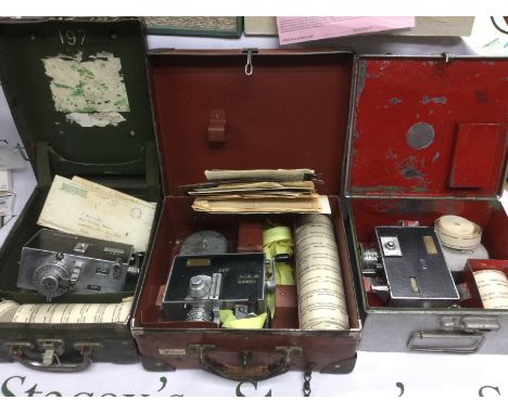 Three vintage bus conductor's ticket machines housed in original carry cases with unused rolls of tickets. Shipping category 