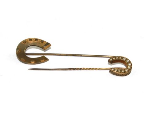 Two horse shoe stick pins