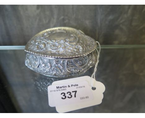 A heart shaped silver trinket box decorated in relief, Chester 1895