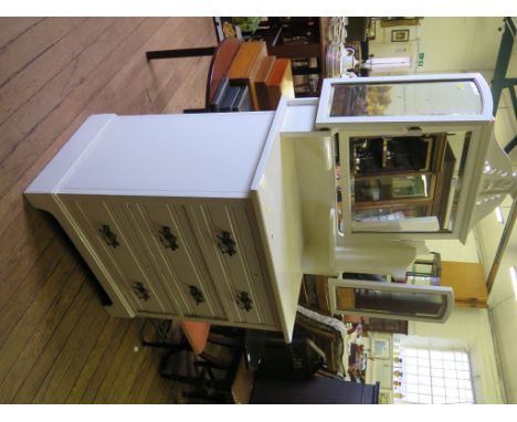 A painted Edwardian dressing chest, the triptych mirrors over three drawers on bracket feet, 84cm wide