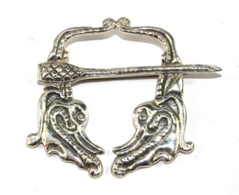 A silver Celtic brooch