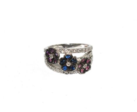 A diamond, sapphire and amethyst ring set in 18 carat white gold