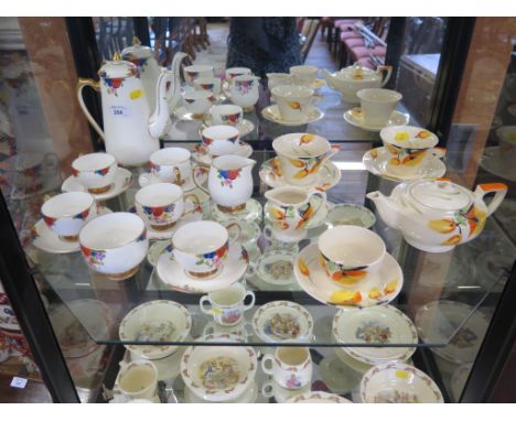 A Myott 'tete a tete' tea service, with painted yellow floral decoration, and a Carlton ware coffee service with six coffee c