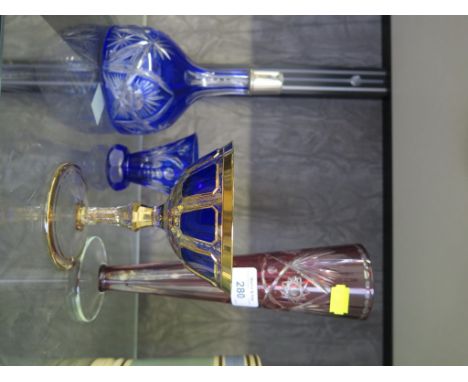 A Bohemian Czech overlay blue glass with gilt decoration and stemmed compot glass bowl together with vase cased red, decanter