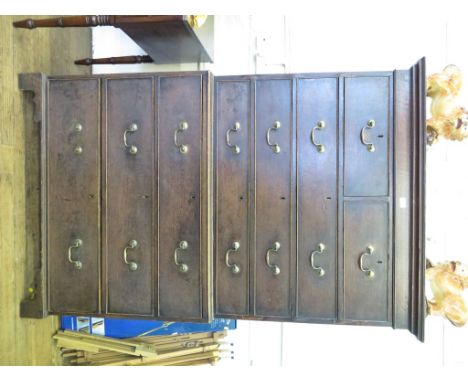 A George III oak chest on chest, the moulded cornice over two short and three long graduated drawers over a further three lon