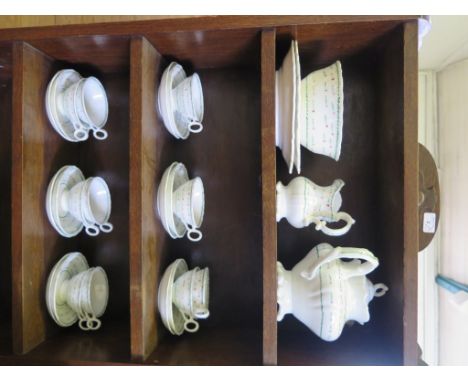 A Victorian tea service, with repeating green and red stylised floral pattern (28 pieces) including teapot and two serving pl
