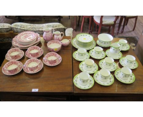 An Edwardian green banded tea service, with urn and husk swags (35 pieces), and a Wedgwood Ferrara pattern part breakfast ser