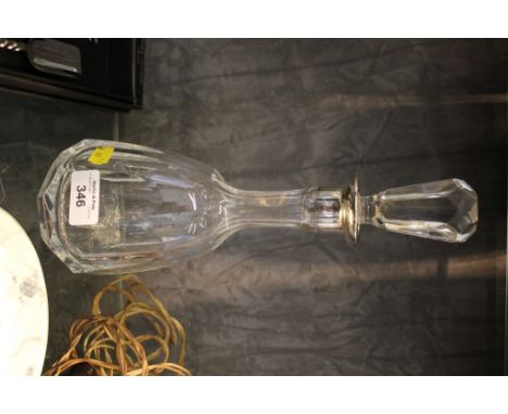 A continental metal collared cut glass decanter of facetted form 30.5cm high