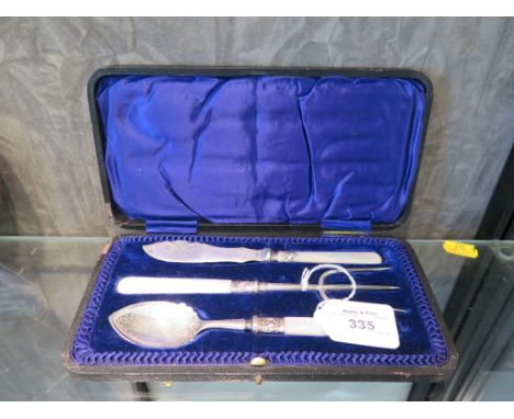 A cased jam spoon, butter knife and bread fork, all with mother of pearl handles